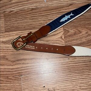 Fish with blue and brown leather band made in ct.Belt with Navy and Cream Design
